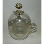 A large glass cup and cover,