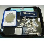 A collection of various silver teaspoons, a silver compact,