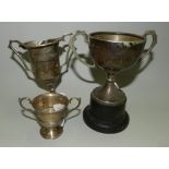 Three silver two handled trophy cups each with engraved presentation