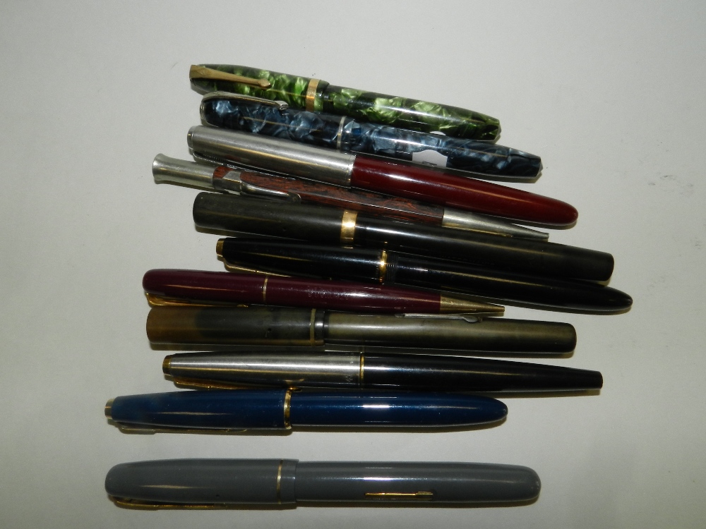 Four Waterman's fountain pens, each with 14 carat gold knib,