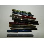 Four Waterman's fountain pens, each with 14 carat gold knib,