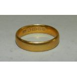 A 22 carat gold plain polished wedding band