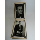 A small autograph album, including signed photographs, containing Stanley Holloway, Ralph Lynn,