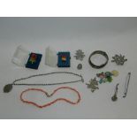 A collection of costume jewellery to include a Victorian silver locket on belcher chain,