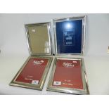 Four silver plated photo frames,