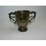 A silver trophy cup with twin scroll handles, Chester 1912,