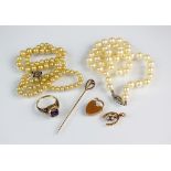 A uniform cultured pearl necklace with diamond set clasp,