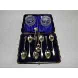 A cased set of six Chester silver coffee spoons together with a pair of pressed glass silver