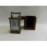 An early 20th century brass cased five glass carriage clock converted to quartz with associated key