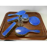 An Art Deco silver and guilloche enamel dressing set comprising two pairs of brushes, mirror,
