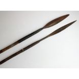 Two 19th century East African spears, one with leather collar, the other with wirebound collar,