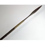 A 19th century East African spear with brass wire binding, and counterweight balance,