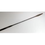 A 19th century East African spear with leather binding and animal skin covered counter weight,