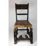 A Chokwe Tribe chair, Angola, SW Africa, with two faces on back splat with skin covered seat,