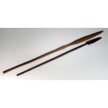 A large South African Zulu wooden marriage spear, and another spear (some losses to smaller spear),