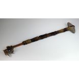 A Native American stone head war hammer club, the head decorated with circles and engravings,