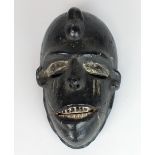 A West African Nigerian painted Ibo tribe mask,