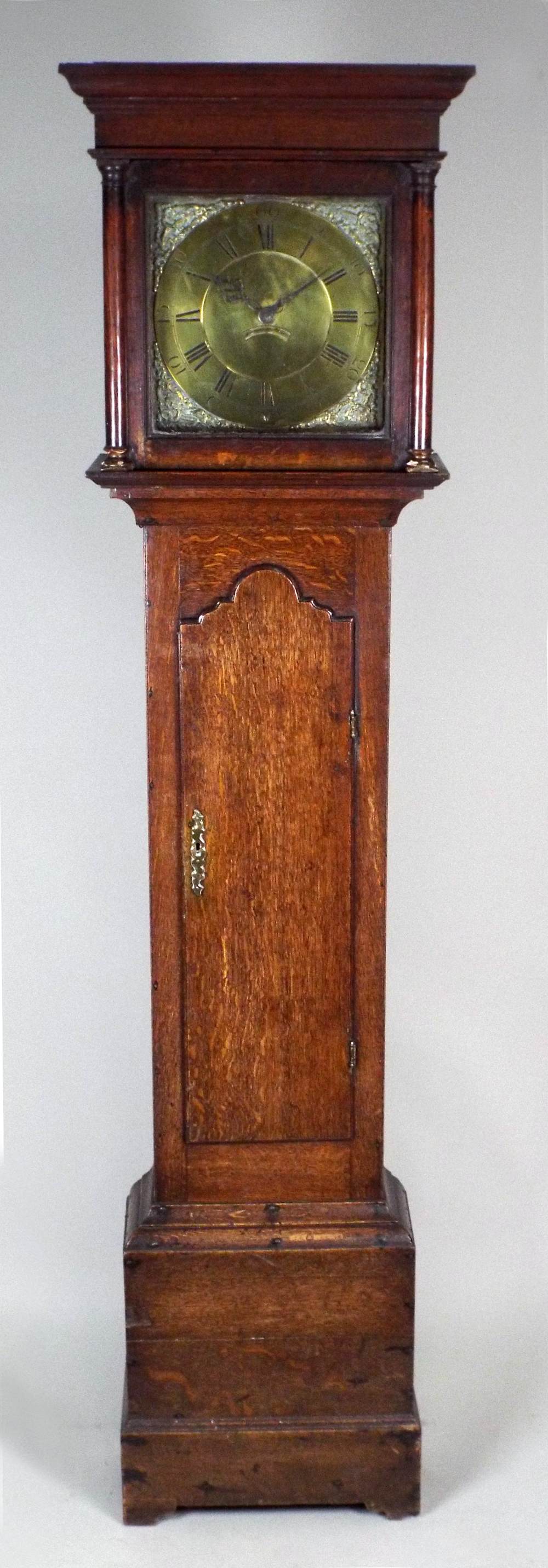 An 18th century oak thirty hour longcase clock, the 11½ inch square brass dial signed ' Sam.
