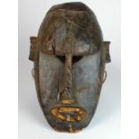 A West African Bambara mask from Mali (with old losses to chin area),