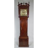 An early 19th century oak crossbanded mahogany longcase clock,