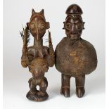 A Yaka fetish bundle figure, Congo and a Luba tribe bird faced Janus fetish,
