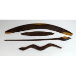 A collection of Australian Aboriginal artefacts to include a Mulga wood boomerang, a snake totem,