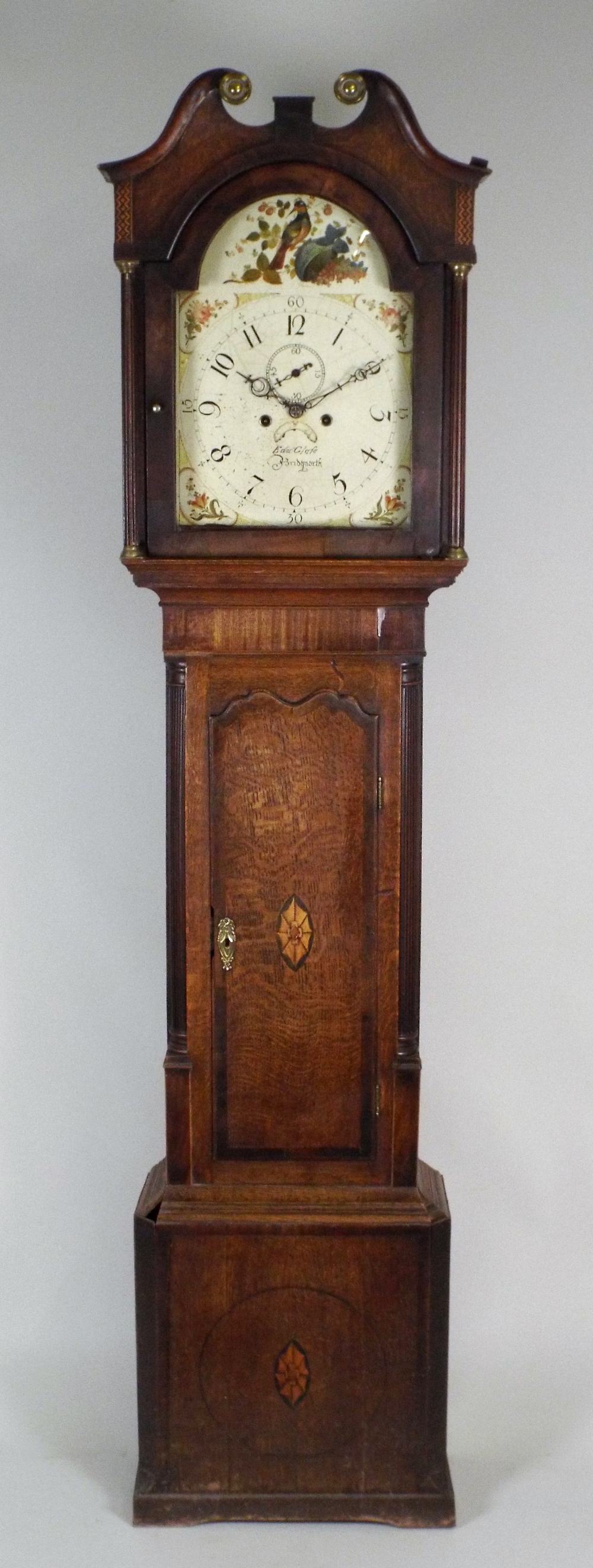 A late George III oak eight day longcase clock, the 12½ painted arched dial later signed 'Edw Glase,