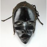 A West African Dan tribe mask with braided hair,