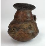 A Central American pre-Columbian style painted terracotta vessel, with lug handle, the rim restored,