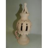 A Southern European terracotta openwork night light and cover,