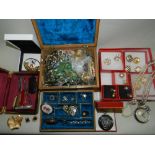 A large collection of various pieces of costume jewellery to include bead necklaces, brooches,