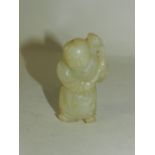 A Chinese jade figure of a boy, 19th/20th century,