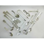 A group of silver forks together with silver spoons and ladles etc.