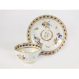 A Caughley polychrome fluted tea bowl and saucer, circa 1790,