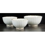 Two Caughley white and gilt fluted tea bowls, 9cm diameter together with a matching sugar bowl,