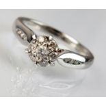 An 18ct white gold diamond floral cluster ring,