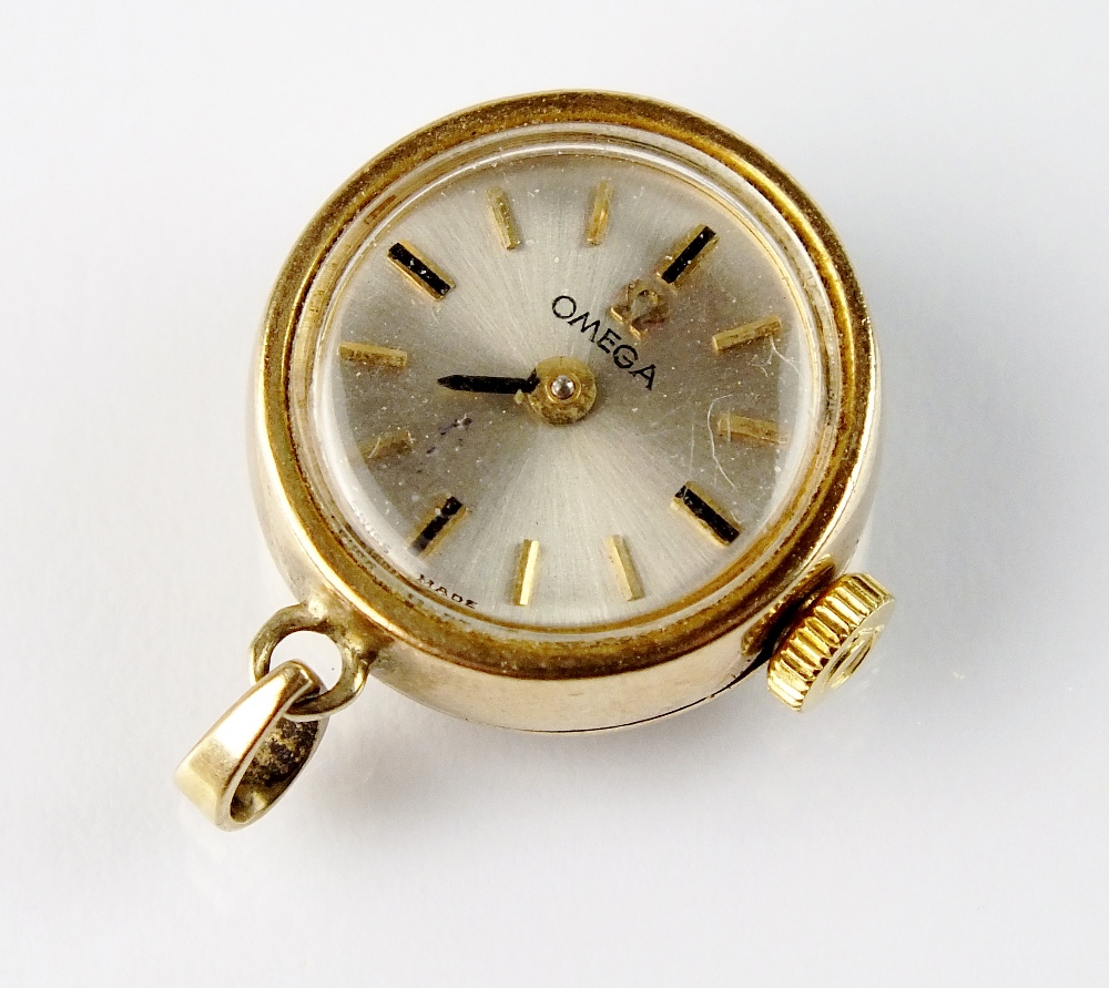 A Lady's 9ct gold Omega pendant watch, the circular silvered dial with batons, manual wind,