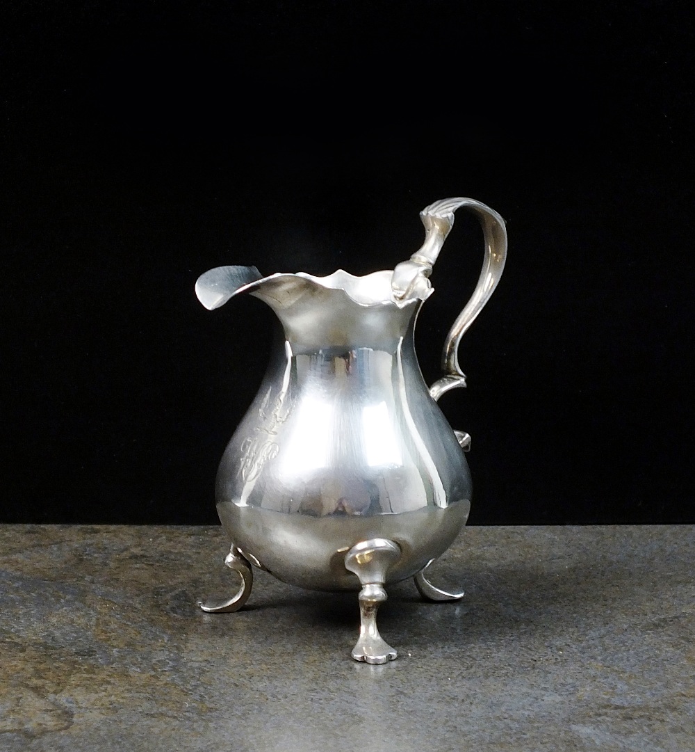 A mid 18th century silver cream jug, marks indistinct, circa 1740,