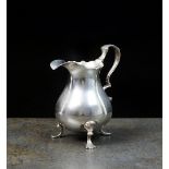 A mid 18th century silver cream jug, marks indistinct, circa 1740,