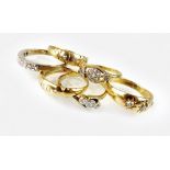 An 18ct gold five stone graduated diamond gypsy style ring,