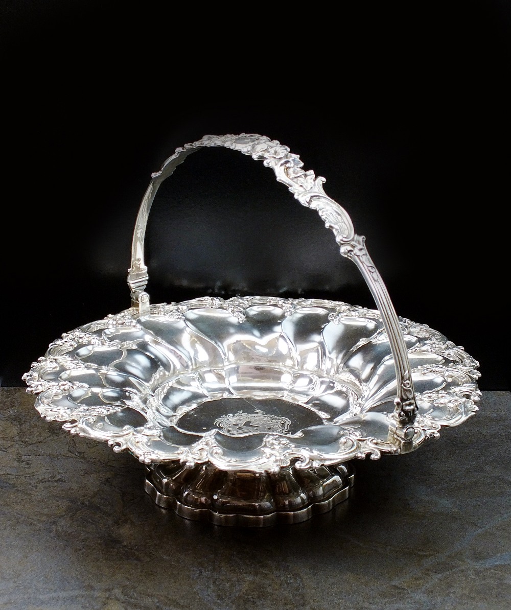 An early 19th century silver swing handled cake basket, William Ker Reid, London, date mark rubbed,