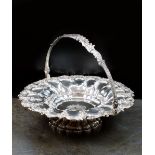 An early 19th century silver swing handled cake basket, William Ker Reid, London, date mark rubbed,