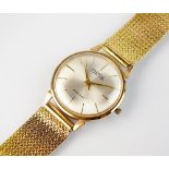 A Gentleman's 9ct gold Ingersoll bracelet wristwatch, the circular silvered dial with batons,