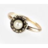 A late 19th century single pearl and diamond cluster ring,
