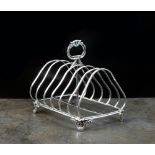 A Victorian silver six division toast rack, ISH, London 1848,