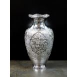 A white metal baluster vase, with chased and engraved bird and foliate decoration to the body,