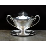 A Victorian Adams style silver sauce tureen, cover and stand, Charles Boyton, London 1892,