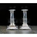 A pair of Edwardian short silver candlesticks, Thomas A Scott, Sheffield 1904,
