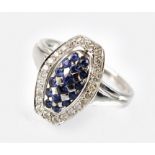 A 14ct white gold sapphire and diamond swivel dress ring,