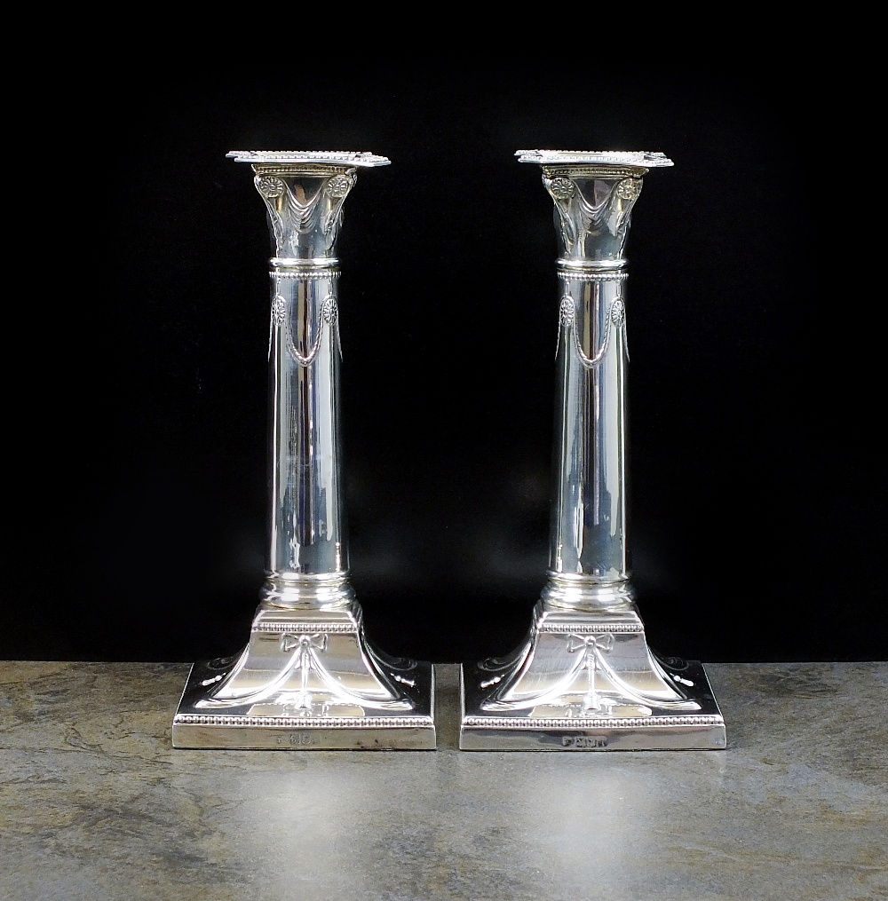 A pair of Edwardian silver candlesticks, Thomas Bradbury & Sons Ltd, London 1904,